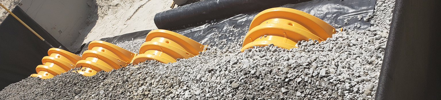 rocks covering drainage pipes